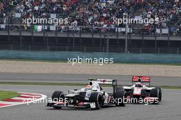 Sergio Perez (MEX) Sauber C31 leads Jenson Button (GBR) McLaren MP4/27. 15.04.2012. Formula 1 World Championship, Rd 3, Chinese Grand Prix, Shanghai, China, Race Day
