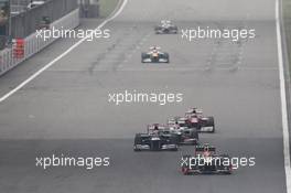 Romain Grosjean (FRA) Lotus F1 E20 leads Pastor Maldonado (VEN) Williams FW34; Sergio Perez (MEX) Sauber C31 and Fernando Alonso (ESP) Ferrari F2012. 15.04.2012. Formula 1 World Championship, Rd 3, Chinese Grand Prix, Shanghai, China, Race Day