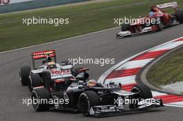 Pastor Maldonado (VEN), Williams F1 Team leads Lewis Hamilton (GBR), McLaren Mercedes  15.04.2012. Formula 1 World Championship, Rd 3, Chinese Grand Prix, Shanghai, China, Race Day