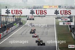 Kimi Raikkonen (FIN) Lotus E20 leads Sebastian Vettel (GER) Red Bull Racing RB8. 15.04.2012. Formula 1 World Championship, Rd 3, Chinese Grand Prix, Shanghai, China, Race Day