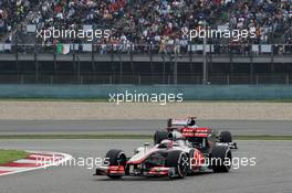 Jenson Button (GBR) McLaren MP4/27 leads Pastor Maldonado (VEN) Williams FW34. 15.04.2012. Formula 1 World Championship, Rd 3, Chinese Grand Prix, Shanghai, China, Race Day