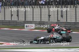 Michael Schumacher (GER) Mercedes AMG F1 W03 leads Jenson Button (GBR) McLaren MP4/27. 15.04.2012. Formula 1 World Championship, Rd 3, Chinese Grand Prix, Shanghai, China, Race Day