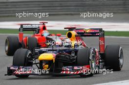 Sebastian Vettel (GER) Red Bull Racing RB8 leads Timo Glock (GER) Marussia F1 Team MR01. 15.04.2012. Formula 1 World Championship, Rd 3, Chinese Grand Prix, Shanghai, China, Race Day