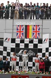 The podium (L to R): Jenson Button (GBR) McLaren, second; Nico Rosberg (GER) Mercedes AMG F1, race winner; Lewis Hamilton (GBR) McLaren, third; Norbert Haug (GER) Mercedes Sporting Director. 15.04.2012. Formula 1 World Championship, Rd 3, Chinese Grand Prix, Shanghai, China, Race Day