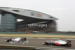 Sergio Perez (MEX) Sauber C31 leads Lewis Hamilton (GBR) McLaren MP4/27. 15.04.2012. Formula 1 World Championship, Rd 3, Chinese Grand Prix, Shanghai, China, Race Day