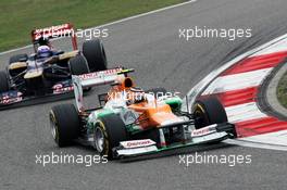 Nico Hulkenberg (GER) Sahara Force India F1 VJM05 leads Daniel Ricciardo (AUS) Scuderia Toro Rosso STR7. 15.04.2012. Formula 1 World Championship, Rd 3, Chinese Grand Prix, Shanghai, China, Race Day