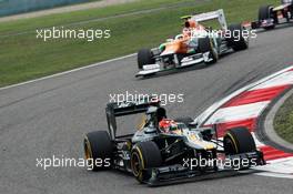 Heikki Kovalainen (FIN) Caterham CT01 leads Nico Hulkenberg (GER) Sahara Force India F1 VJM05. 15.04.2012. Formula 1 World Championship, Rd 3, Chinese Grand Prix, Shanghai, China, Race Day