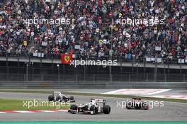 Kamui Kobayashi (JPN) Sauber C31 leads Romain Grosjean (FRA) Lotus F1 E20 and Sergio Perez (MEX) Sauber C31. 15.04.2012. Formula 1 World Championship, Rd 3, Chinese Grand Prix, Shanghai, China, Race Day