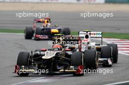 Romain Grosjean (FRA) Lotus F1 E20 leads Sergio Perez (MEX) Sauber C31. 15.04.2012. Formula 1 World Championship, Rd 3, Chinese Grand Prix, Shanghai, China, Race Day