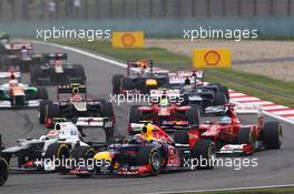 Mark Webber (AUS) Red Bull Racing RB8 and Sergio Perez (MEX) Sauber C31 at the start of the race. 15.04.2012. Formula 1 World Championship, Rd 3, Chinese Grand Prix, Shanghai, China, Race Day