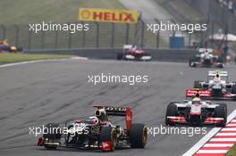 Kimi Raikkonen (FIN) Lotus E20 leads Lewis Hamilton (GBR) McLaren MP4/27. 15.04.2012. Formula 1 World Championship, Rd 3, Chinese Grand Prix, Shanghai, China, Race Day