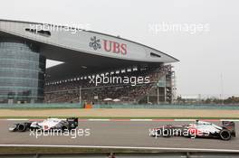 Sergio Perez (MEX) Sauber C31 leads Lewis Hamilton (GBR) McLaren MP4/27. 15.04.2012. Formula 1 World Championship, Rd 3, Chinese Grand Prix, Shanghai, China, Race Day