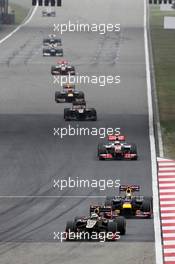 Romain Grosjean (FRA) Lotus F1 E20 leads Sebastian Vettel (GER) Red Bull Racing RB8. 15.04.2012. Formula 1 World Championship, Rd 3, Chinese Grand Prix, Shanghai, China, Race Day