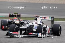 Kamui Kobayashi (JPN) Sauber C31 leads Romain Grosjean (FRA) Lotus F1 E20. 15.04.2012. Formula 1 World Championship, Rd 3, Chinese Grand Prix, Shanghai, China, Race Day