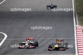 (L to R): Lewis Hamilton (GBR) McLaren MP4/27 and Mark Webber (AUS) Red Bull Racing RB8 battle for position. 15.04.2012. Formula 1 World Championship, Rd 3, Chinese Grand Prix, Shanghai, China, Race Day