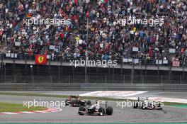 Kamui Kobayashi (JPN) Sauber C31 leads Sergio Perez (MEX) Sauber C31 and Romain Grosjean (FRA) Lotus F1 E20. 15.04.2012. Formula 1 World Championship, Rd 3, Chinese Grand Prix, Shanghai, China, Race Day