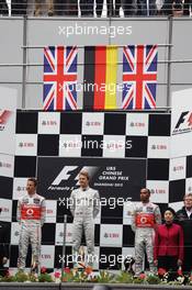 The podium (L to R): Jenson Button (GBR) McLaren, second; Nico Rosberg (GER) Mercedes AMG F1, race winner; Lewis Hamilton (GBR) McLaren, third; Norbert Haug (GER) Mercedes Sporting Director. 15.04.2012. Formula 1 World Championship, Rd 3, Chinese Grand Prix, Shanghai, China, Race Day