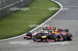 (L to R): Lewis Hamilton (GBR) McLaren MP4/27 and Mark Webber (AUS) Red Bull Racing RB8 battle for position. 15.04.2012. Formula 1 World Championship, Rd 3, Chinese Grand Prix, Shanghai, China, Race Day