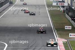 Nico Hulkenberg (GER) Sahara Force India F1 VJM05 leads Daniel Ricciardo (AUS) Scuderia Toro Rosso STR7. 15.04.2012. Formula 1 World Championship, Rd 3, Chinese Grand Prix, Shanghai, China, Race Day