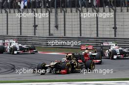 Kimi Raikkonen (FIN) Lotus E20 leads Lewis Hamilton (GBR) McLaren MP4/27 and Sergio Perez (MEX) Sauber C31. 15.04.2012. Formula 1 World Championship, Rd 3, Chinese Grand Prix, Shanghai, China, Race Day