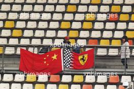 Ferrari fan and flags.