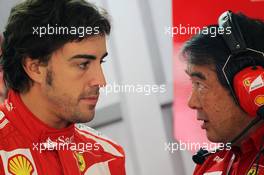 (L to R): Fernando Alonso (ESP) Ferrari with Hirohide Hamashima (JPN) Ferrari Tyre Engineer. 14.04.2012. Formula 1 World Championship, Rd 3, Chinese Grand Prix, Shanghai, China, Qualifying Day