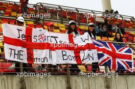 Jenson Button (GBR) McLaren fans and banners.