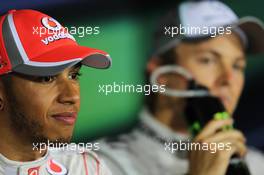 Lewis Hamilton (GBR) McLaren and pole sitter Nico Rosberg (GER) Mercedes AMG F1 in the post qualifying FIA Press Conference. 14.04.2012. Formula 1 World Championship, Rd 3, Chinese Grand Prix, Shanghai, China, Qualifying Day