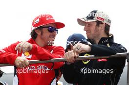 (L to R): Fernando Alonso (ESP) Ferrari with Romain Grosjean (FRA) Lotus F1 Team on the drivers parade. 15.04.2012. Formula 1 World Championship, Rd 3, Chinese Grand Prix, Shanghai, China, Race Day