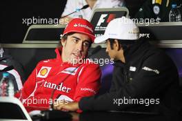 (L to R): Fernando Alonso (ESP) Ferrari with Narain Karthikeyan (IND) Hispania Racing F1 Team (HRT) in the FIA Press Conference. 12.04.2012. Formula 1 World Championship, Rd 3, Chinese Grand Prix, Shanghai, China, Preparation Day