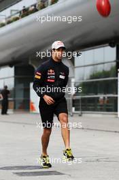 Daniel Ricciardo (AUS) Scuderia Toro Rosso plays Australian Rules Football in the paddock. 12.04.2012. Formula 1 World Championship, Rd 3, Chinese Grand Prix, Shanghai, China, Preparation Day