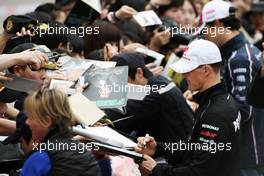 Michael Schumacher (GER) Mercedes AMG F1 signs autographs for the fans. 12.04.2012. Formula 1 World Championship, Rd 3, Chinese Grand Prix, Shanghai, China, Preparation Day