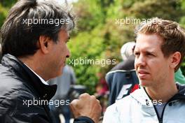 (L to R): Pasquale Lattuneddu (ITA) of the FOM with Sebastian Vettel (GER) Red Bull Racing. 12.04.2012. Formula 1 World Championship, Rd 3, Chinese Grand Prix, Shanghai, China, Preparation Day