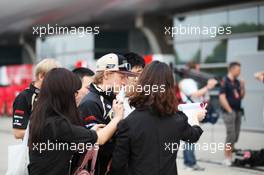Kimi Raikkonen (FIN) Lotus F1 Team signs autographs for the fans. 12.04.2012. Formula 1 World Championship, Rd 3, Chinese Grand Prix, Shanghai, China, Preparation Day