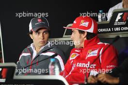 (L to R): Sergio Perez (MEX) Sauber with Fernando Alonso (ESP) Ferrari in the FIA Press Conference. 12.04.2012. Formula 1 World Championship, Rd 3, Chinese Grand Prix, Shanghai, China, Preparation Day