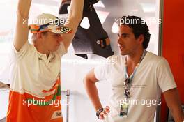 (L to R): Nico Hulkenberg (GER) Sahara Force India F1 with Adrian Sutil (GER) in the Sahara Force India F1 Team garage. 11.05.2012. Formula 1 World Championship, Rd 5, Spanish Grand Prix, Barcelona, Spain, Practice Day