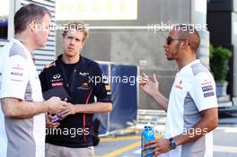 Lewis Hamilton (GBR) McLaren with Sebastian Vettel (GER) Red Bull Racing (Centre). 11.05.2012. Formula 1 World Championship, Rd 5, Spanish Grand Prix, Barcelona, Spain, Practice Day