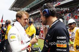 Sebastian Vettel (GER) Red Bull Racing with Guillaume Rocquelin  (ITA) Red Bull Racing Race Engineer on the grid. 10.05.2012. Formula 1 World Championship, Rd 5, Spanish Grand Prix, Barcelona, Spain, Race Day