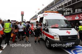 Ambulances enter the pits after a post race fire destroys the Williams pit garage. 10.05.2012. Formula 1 World Championship, Rd 5, Spanish Grand Prix, Barcelona, Spain, Race Day