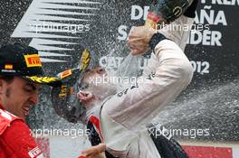 Race winner Pastor Maldonado (VEN) Williams celebrates on the podium with second placed Fernando Alonso (ESP) Ferrari. 10.05.2012. Formula 1 World Championship, Rd 5, Spanish Grand Prix, Barcelona, Spain, Race Day