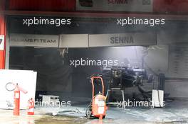 The destroyed Williams FW34 of Bruno Senna (BRA) Williams after a post race fire in the pit garage. 10.05.2012. Formula 1 World Championship, Rd 5, Spanish Grand Prix, Barcelona, Spain, Race Day