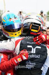 (L to R): second placed Fernando Alonso (ESP) Ferrari celebrates with race winner Pastor Maldonado (VEN) Williams in parc ferme. 10.05.2012. Formula 1 World Championship, Rd 5, Spanish Grand Prix, Barcelona, Spain, Race Day