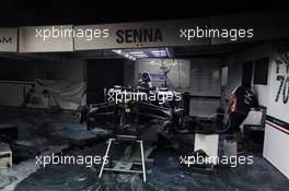 The destroyed remains of the Williams FW34 of Bruno Senna (BRA) Williams and the pit garage after a post race fire. 10.05.2012. Formula 1 World Championship, Rd 5, Spanish Grand Prix, Barcelona, Spain, Race Day