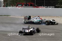 Bruno Senna (BRA) Williams FW34and Michael Schumacher (GER) Mercedes AMG F1 W03 crash together during the race. 10.05.2012. Formula 1 World Championship, Rd 5, Spanish Grand Prix, Barcelona, Spain, Race Day