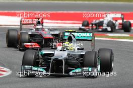 Nico Rosberg (GER) Mercedes AMG F1 W03 leads Jenson Button (GBR) McLaren MP4/27. 10.05.2012. Formula 1 World Championship, Rd 5, Spanish Grand Prix, Barcelona, Spain, Race Day
