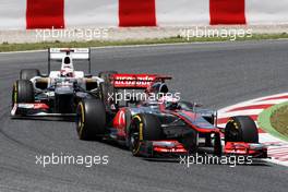 Jenson Button (GBR) McLaren MP4/27 leads Kamui Kobayashi (JPN) Sauber C31. 10.05.2012. Formula 1 World Championship, Rd 5, Spanish Grand Prix, Barcelona, Spain, Race Day