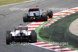 Jenson Button (GBR) McLaren MP4/27 leads Kamui Kobayashi (JPN) Sauber C31. 10.05.2012. Formula 1 World Championship, Rd 5, Spanish Grand Prix, Barcelona, Spain, Race Day