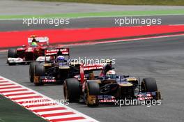 Jean-Eric Vergne (FRA) Scuderia Toro Rosso STR7 leads team mate Daniel Ricciardo (AUS) Scuderia Toro Rosso STR7. 10.05.2012. Formula 1 World Championship, Rd 5, Spanish Grand Prix, Barcelona, Spain, Race Day