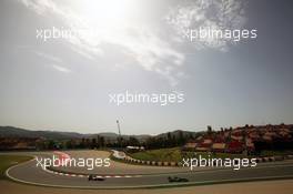 Heikki Kovalainen (FIN) Caterham CT01 leads Narain Karthikeyan (IND) HRT Formula One Team HRT F112. 12.05.2012. Formula 1 World Championship, Rd 5, Spanish Grand Prix, Barcelona, Spain, Qualifying Day