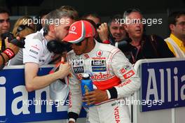 (L to R): Steve Cooper (GBR) McLaren Press Officer talks with pole sitter Lewis Hamilton (GBR) McLaren in parc ferme after qualifying. 12.05.2012. Formula 1 World Championship, Rd 5, Spanish Grand Prix, Barcelona, Spain, Qualifying Day